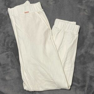 Cleo Harper White joggers with cream lined Pockets.